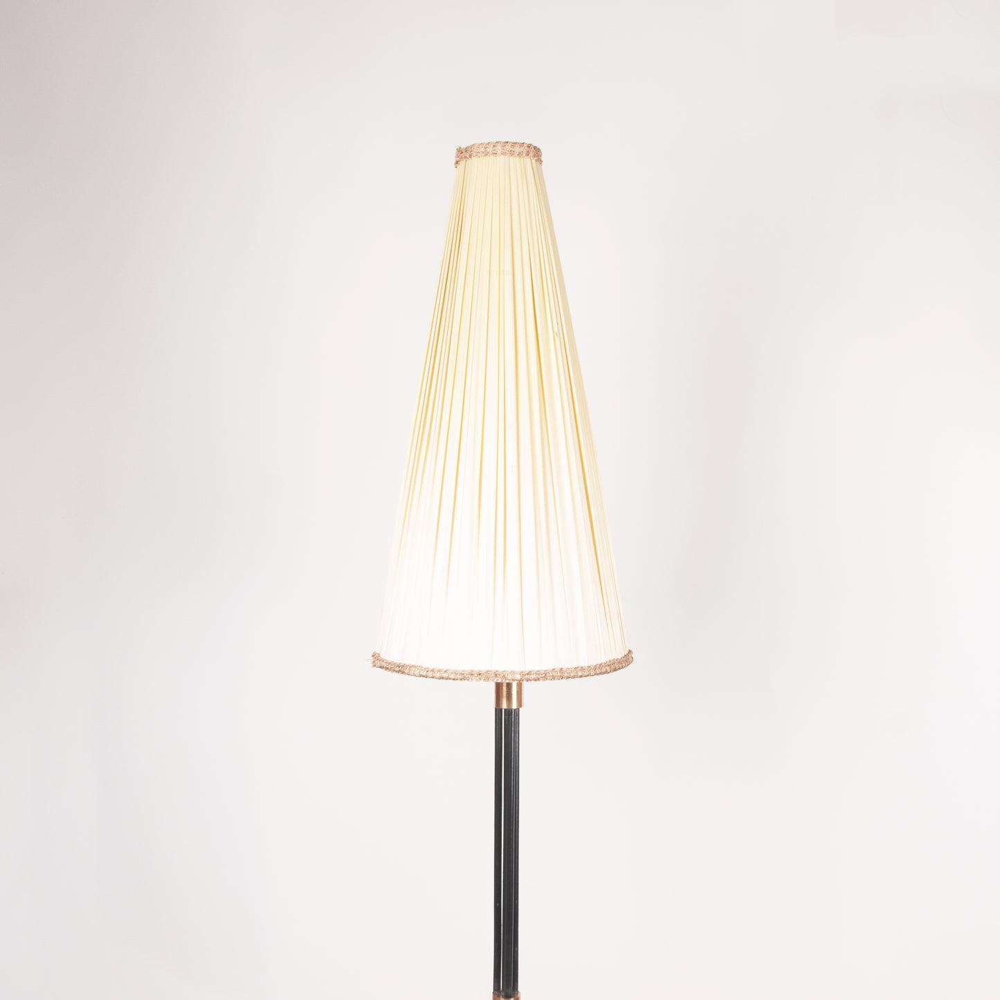 Floor lamp with conical pleated shade