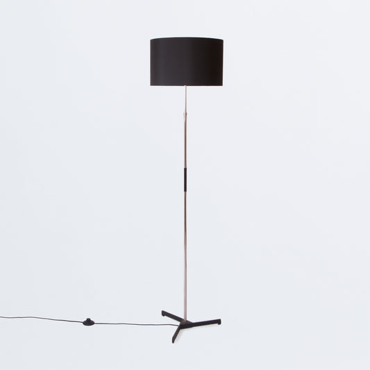 Floor lamp on black tripod base