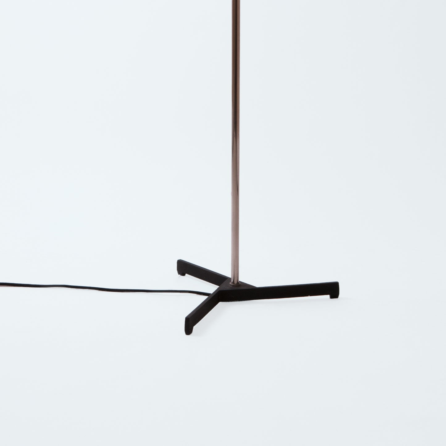 Floor lamp on black tripod base