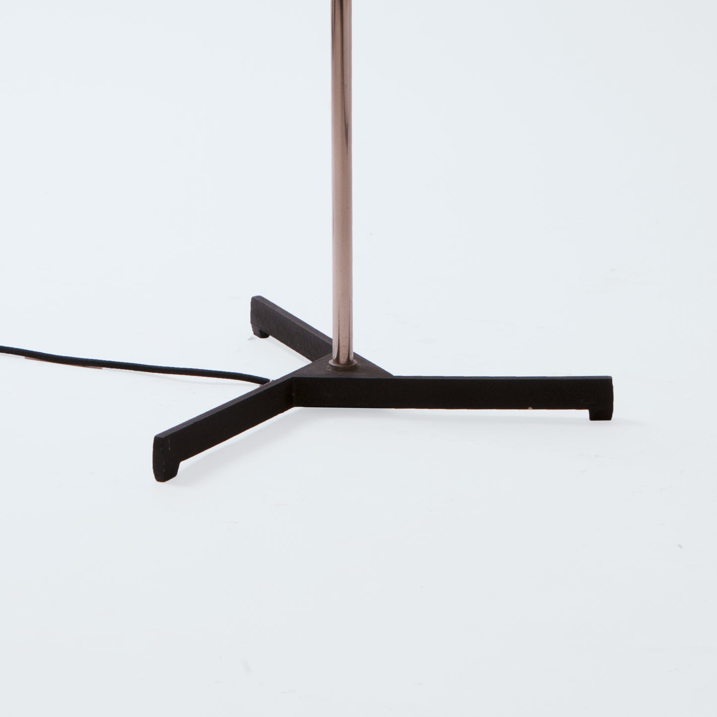Floor lamp on black tripod base