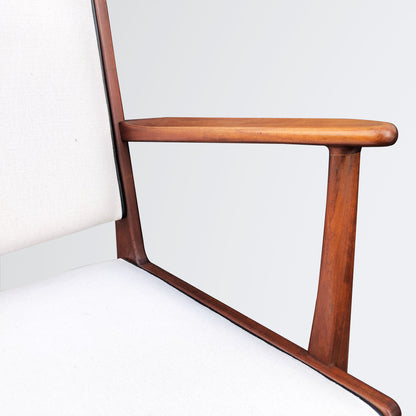 Pair of easy chairs with leather piping